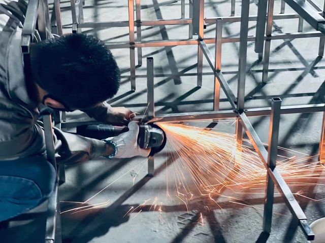 Welding a lighting frame in our workshop